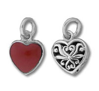 Two heart-shaped silver and red charms
