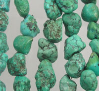 Strands of rough turquoise nugget beads