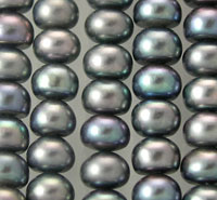 Close-up of iridescent black pearls