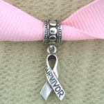 Pink ribbon with silver survivor charm