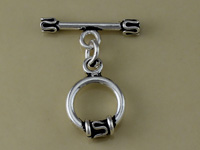 Silver toggle clasp brooch with circular pendant