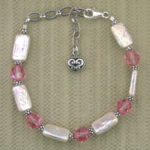 Pink and pearl beaded bracelet with heart charm
