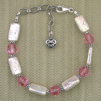 Pink and pearl beaded bracelet with heart charm