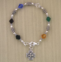 Colorful beaded bracelet with silver cross charm