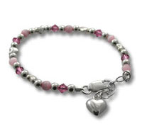 Silver and pink beaded bracelet with heart charm