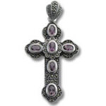 Ornate silver cross pendant with purple stones