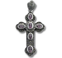 Ornate silver cross pendant with purple stones