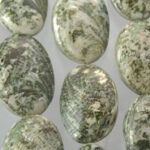 Green speckled oval polished stone beads