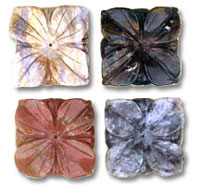 Four carved square floral stone beads