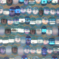 Close-up of iridescent glass seed beads