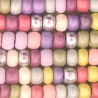 Close-up of colorful pastel beads arranged in rows