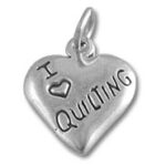 Silver heart charm stamped "I ♥ QUILTING