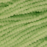 Pale green seed bead strands close-up