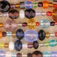 Strands of colorful faceted glass beads