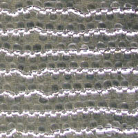 Green knitted fabric with white scalloped stripes