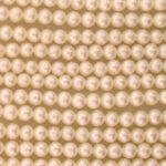 Close-up of cream pearl bead strands