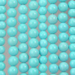 Close-up of glossy turquoise bead strands