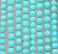 Close-up of glossy turquoise bead strands