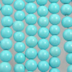 Turquoise beads arranged in vertical rows
