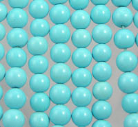 Turquoise beads arranged in vertical rows