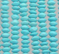 Rows of turquoise oval beads on strings