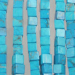 Strands of turquoise square beads