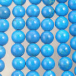 Close-up of glossy blue round beads