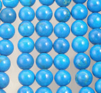 Close-up of glossy blue round beads