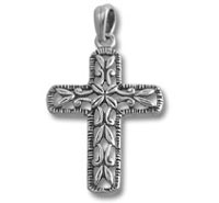 silver ornate cross pendant with leaf pattern