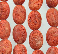 Close-up of red porous bead strands