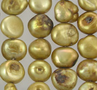 Close-up of lustrous irregular golden pearls