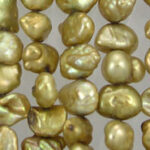 Close-up of gold baroque pearls