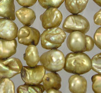Close-up of gold baroque pearls