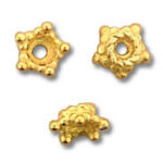 Three gold filigree bead caps