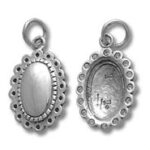 Two oval scalloped silver pendant bezels