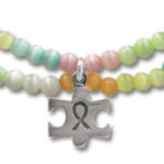 Pastel beaded bracelets with puzzle-piece awareness charm