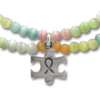 Pastel beaded bracelets with puzzle-piece awareness charm