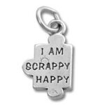 Silver puzzle-piece charm engraved "I AM SCRAPPY HAPPY