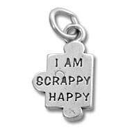 Silver puzzle-piece charm engraved "I AM SCRAPPY HAPPY