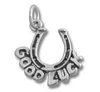 Silver horseshoe charm reading Good Luck