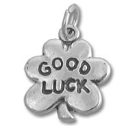 silver four-leaf clover charm saying Good Luck