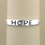 Silver band engraved with HOPE