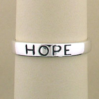 Silver band engraved with HOPE