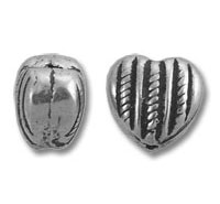 Two silver decorative beads, one heart-shaped