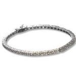 Sparkling silver tennis bracelet on white background