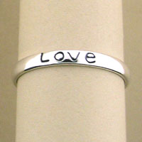 Silver bangle engraved with Love