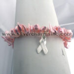 Pink beaded bracelet with silver ribbon charm
