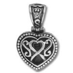 Ornate silver heart pendant with filigree design