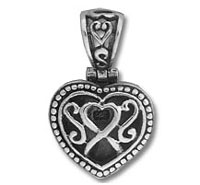 Ornate silver heart pendant with filigree design