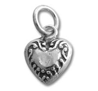 Silver heart charm pendant with ornate filigree